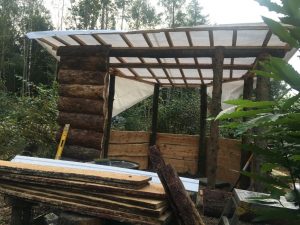 Tarpaulin on and 2 post fitted to front to take 800mm cladded boards
